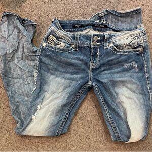 low waisted, rips in the jeans, and very cute back pockets!